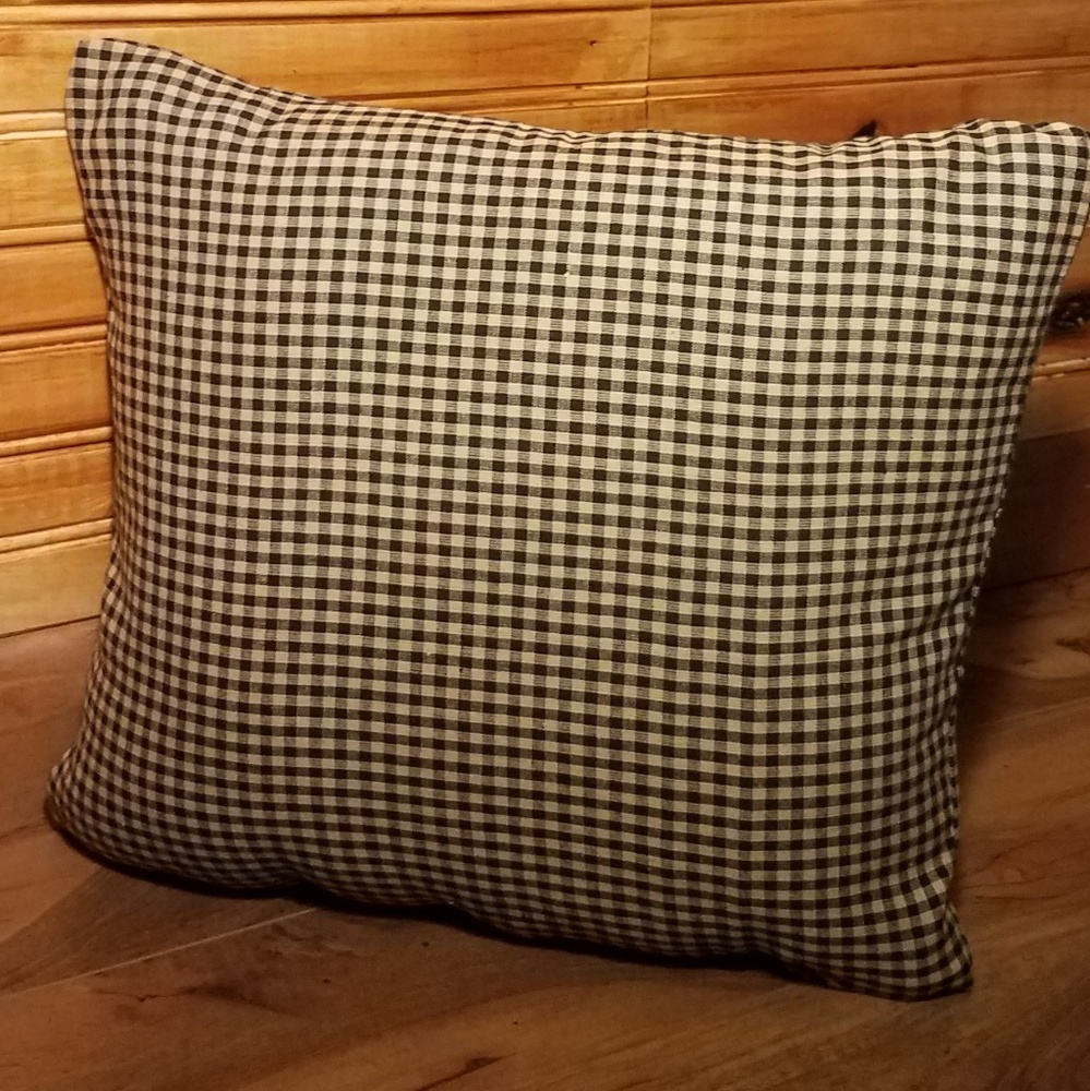 Black and tan checkered pillow